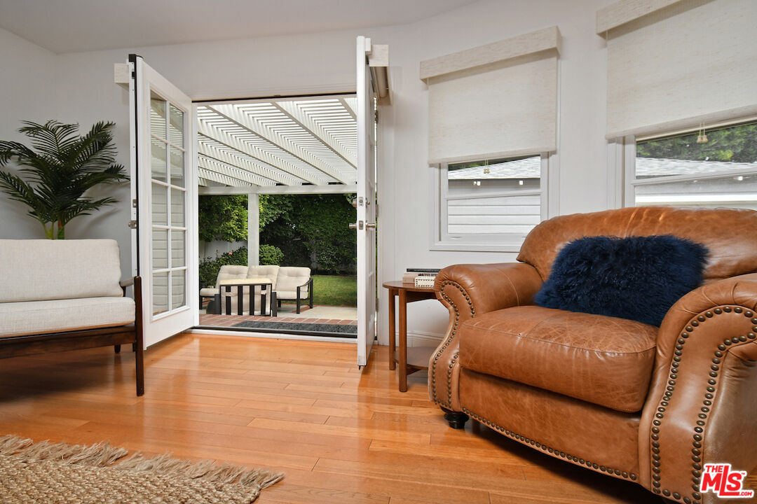 4226 Greenbush Avenue Sherman Oaks, CA 91423 - Photo 26 of 69 a living room with furniture and a floor to ceiling window