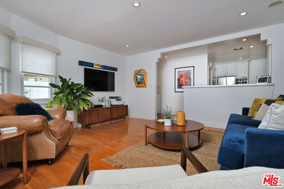 4226 Greenbush Avenue Sherman Oaks, CA 91423 - Photo 27 of 69 a living room with furniture and a flat screen tv