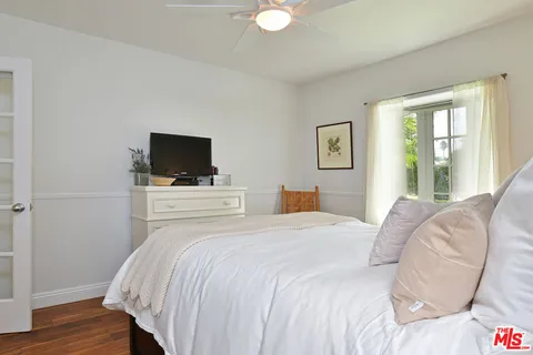 a spacious bathroom with a bathtub and sink