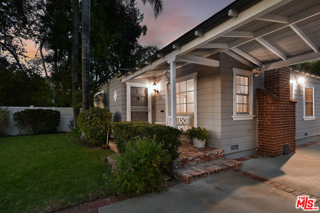 4226 Greenbush Avenue Sherman Oaks, CA 91423 - Photo 4 of 69 a front view of a house with garden