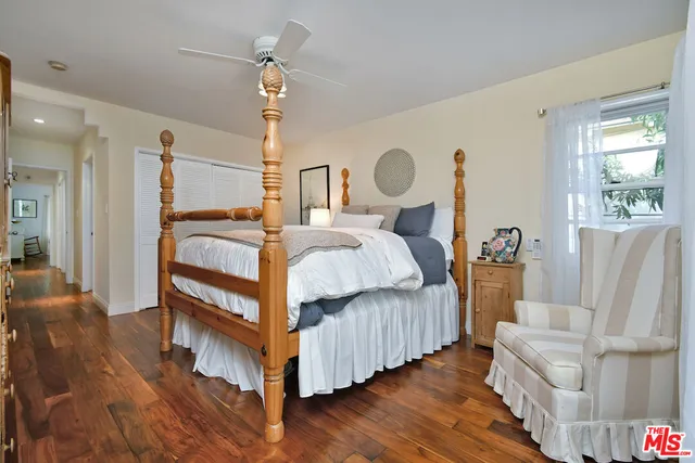 a backyard of a house with plants and trees