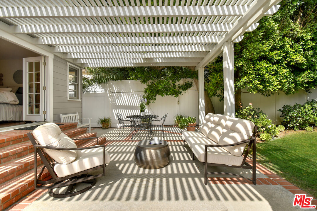4226 Greenbush Avenue Sherman Oaks, CA 91423 - Photo 53 of 69 a view of a house with a porch and furniture