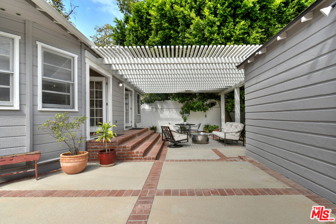 4226 Greenbush Avenue Sherman Oaks, CA 91423 - Photo 62 of 69 a view of a patio with chairs and potted plants