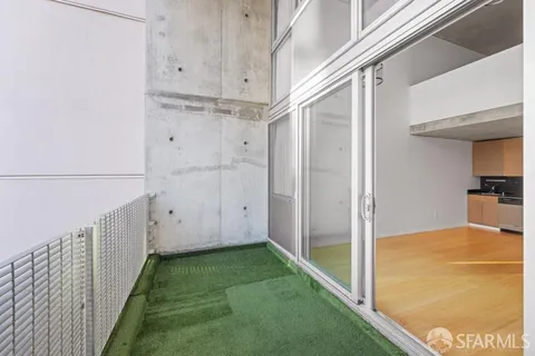 a view of a hallway with kitchen
