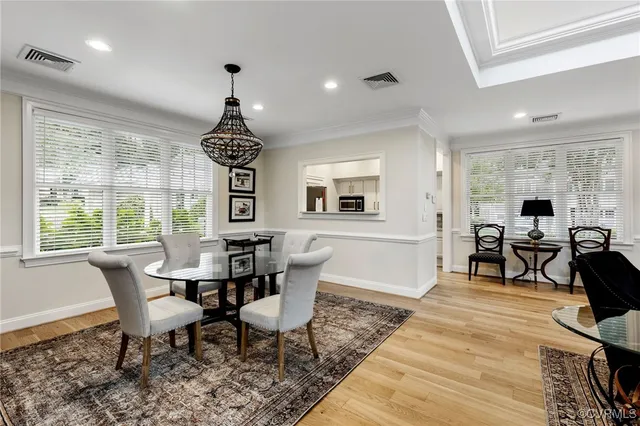 a view of a livingroom with furniture window and wooden floor