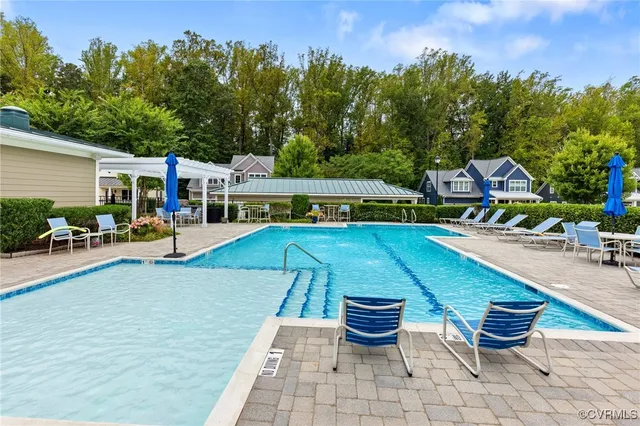 a view of a patio with chairs and plants