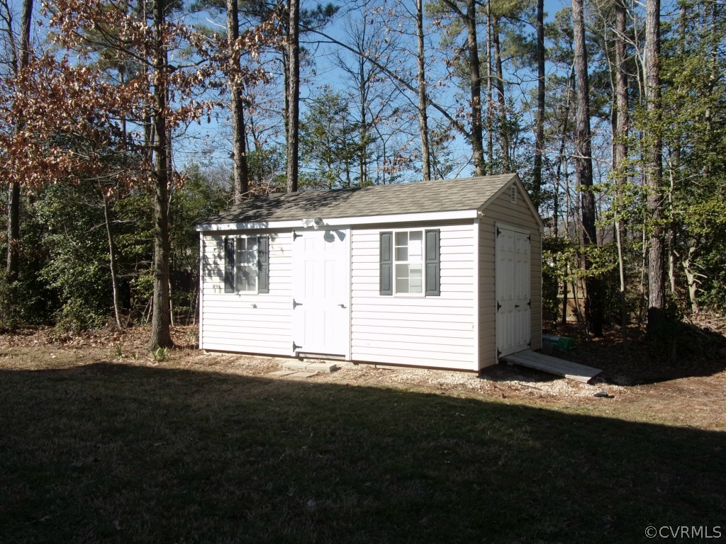 802 Club Ridge Court Chester, VA 23836 - Photo 3 of 7 a view of a white house with a yard