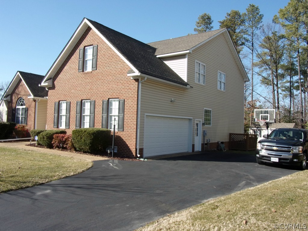 802 Club Ridge Court Chester, VA 23836 - Photo 5 of 7 a front view of a house with a yard