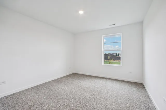 a view of a livingroom with workspace and a couch