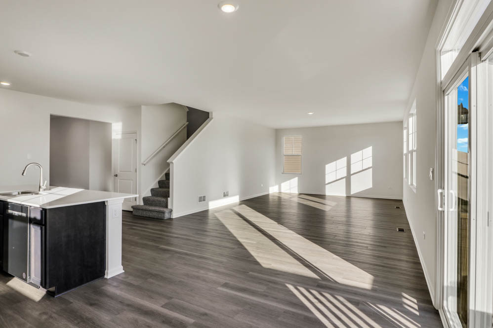 9967 Edgebrook Lane Huntley, IL 60142 - Photo 7 of 65 a view of a living room with hardwood floor and a ceiling fan