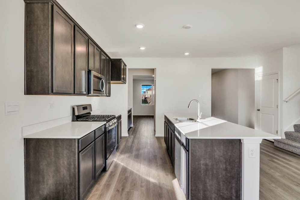 9967 Edgebrook Lane Huntley, IL 60142 - Photo 8 of 65 a kitchen with stainless steel appliances granite countertop a sink a stove and a refrigerator