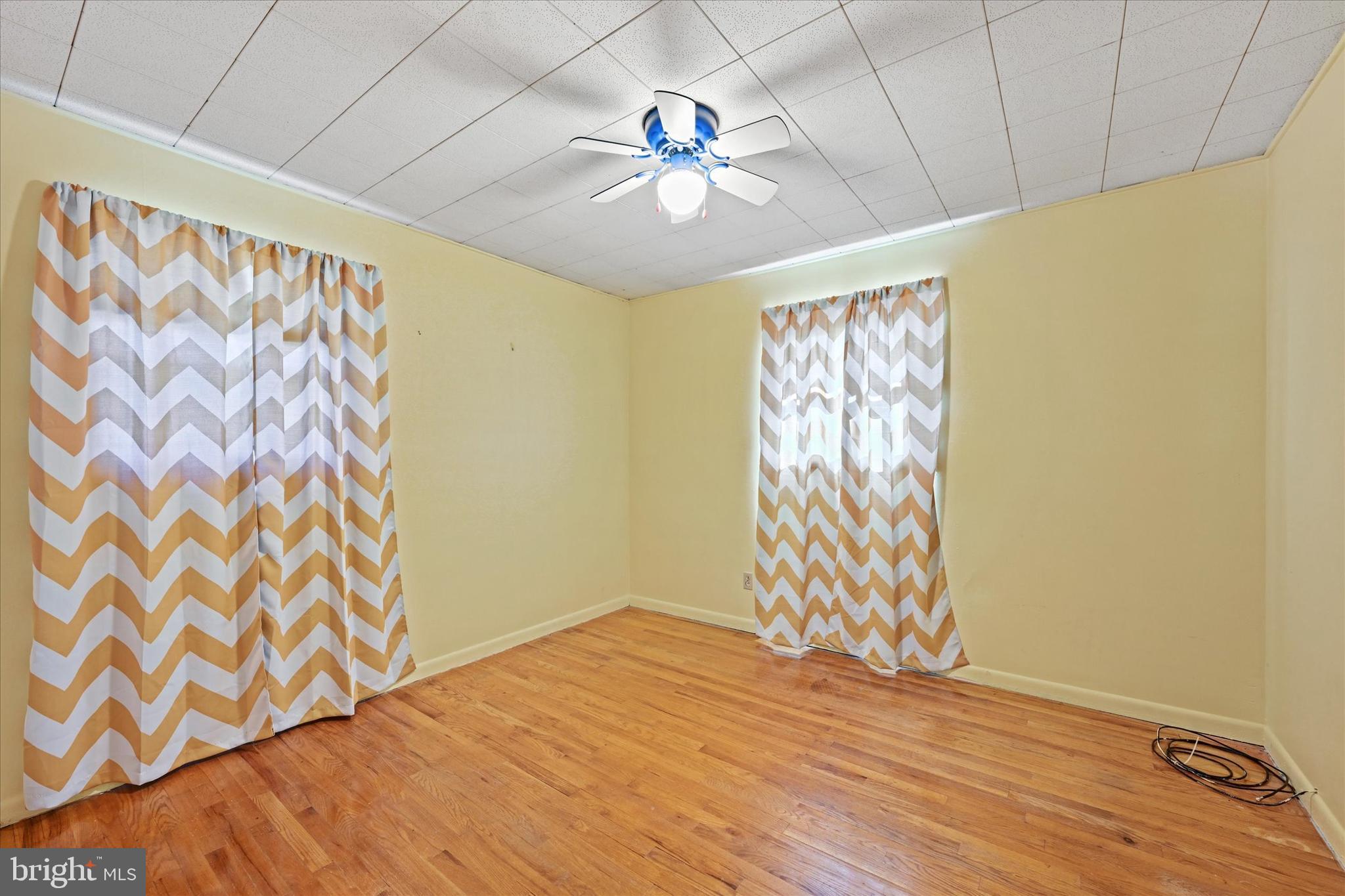 3714 Parkfield Road Windsor Mill, MD 21244 - Photo 15 of 28 a view of an empty room with a window and wooden floor