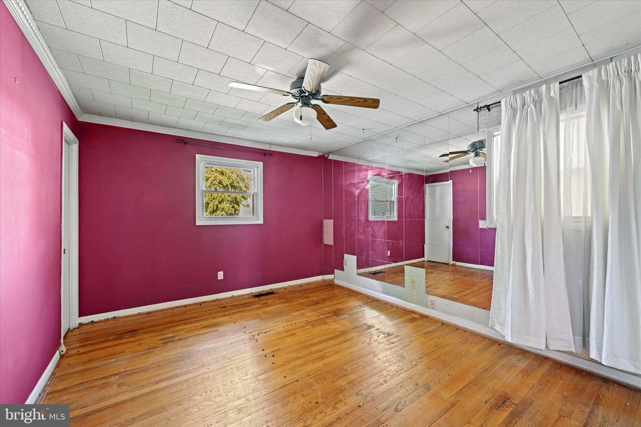 3714 Parkfield Road Windsor Mill, MD 21244 - Photo 16 of 28 a view of a livingroom with a sofa and a ceiling fan
