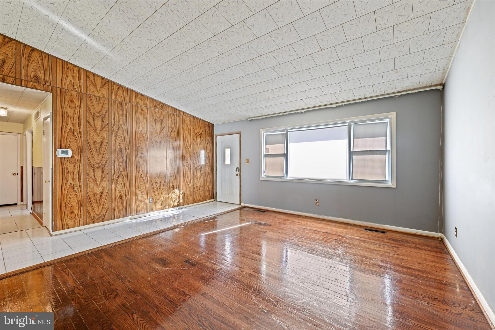 3714 Parkfield Road Windsor Mill, MD 21244 - Photo 4 of 28 a view of an empty room with wooden floor and a window