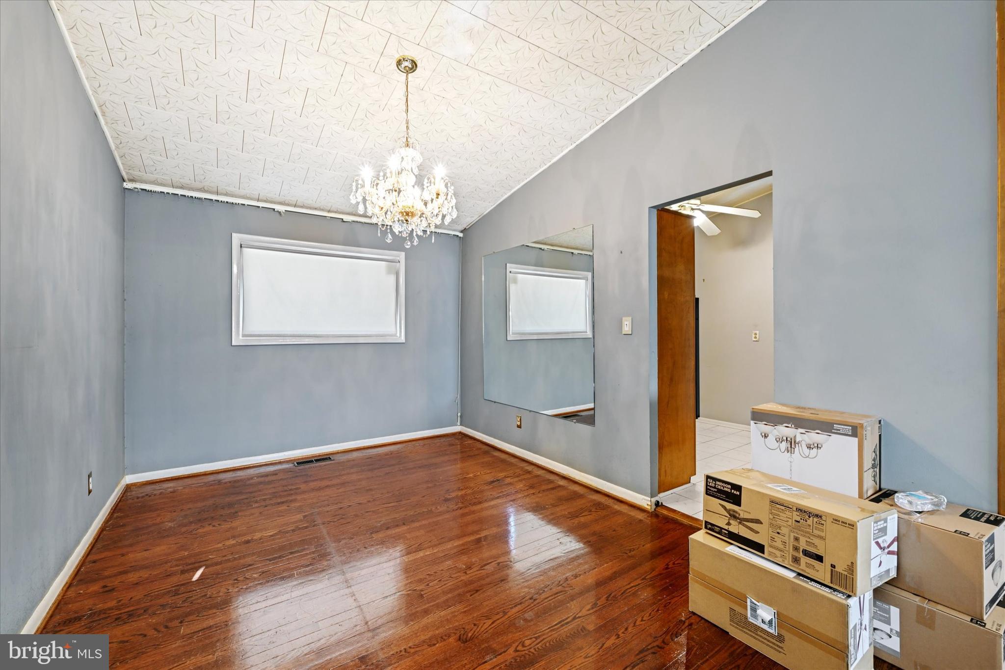 3714 Parkfield Road Windsor Mill, MD 21244 - Photo 7 of 28 a view of a room with wooden floor and ceiling fan