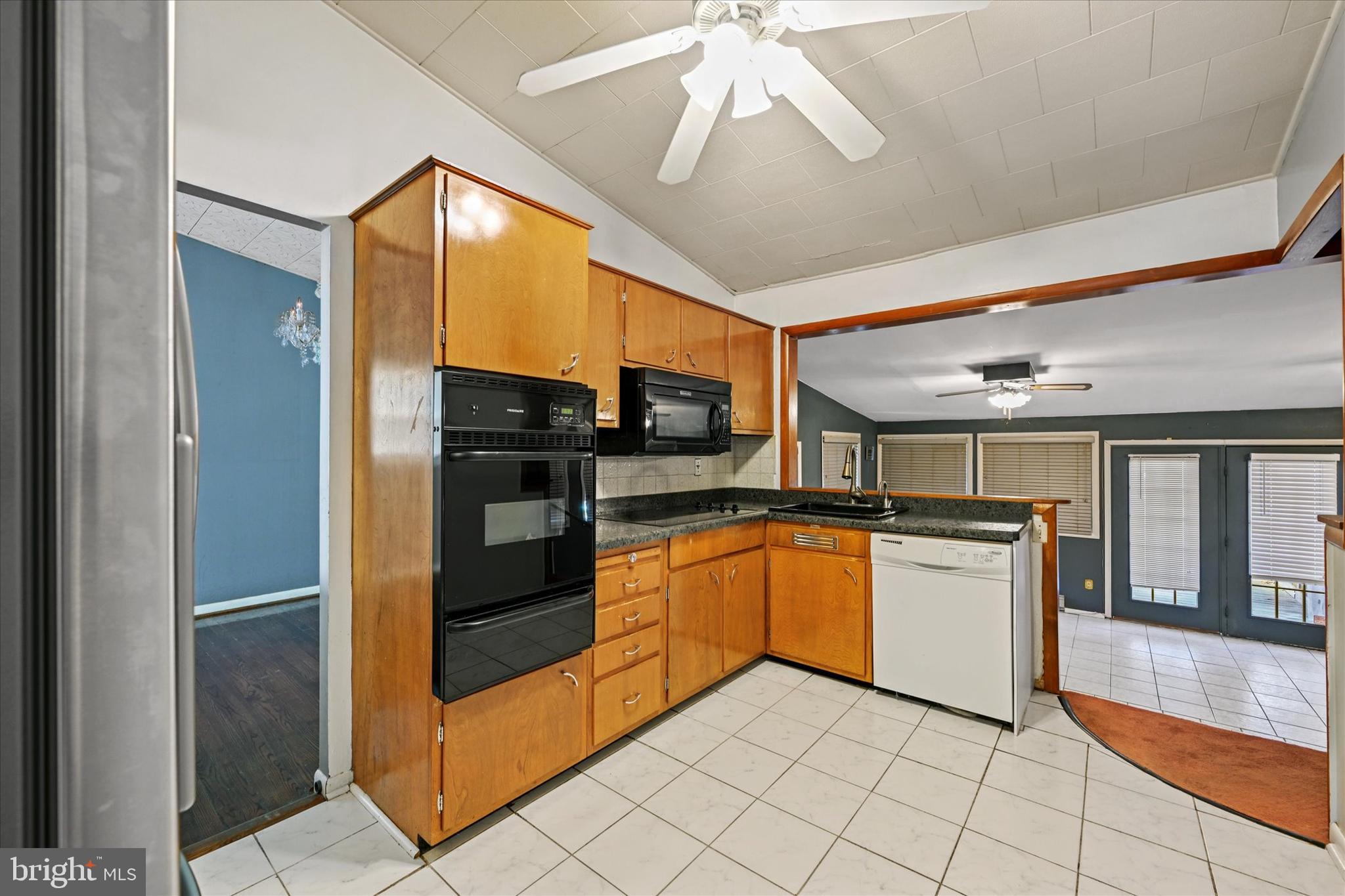 3714 Parkfield Road Windsor Mill, MD 21244 - Photo 9 of 28 a kitchen with stainless steel appliances granite countertop a refrigerator and a sink