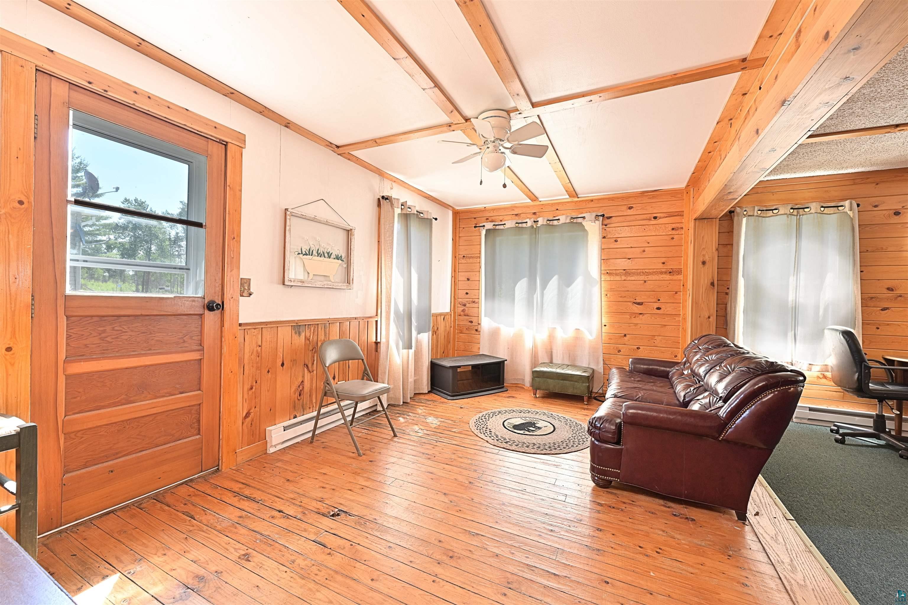 9724 State Highway 1 Isabella, MN 55607 - Photo 7 of 19 Living space featuring wood-finish flooring and extensive wood paneling