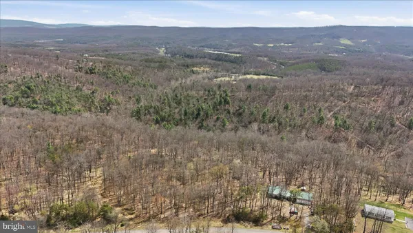 a view of a houses in a field