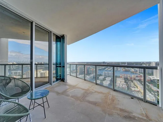 a bathroom with a granite countertop sink mirror and toilet
