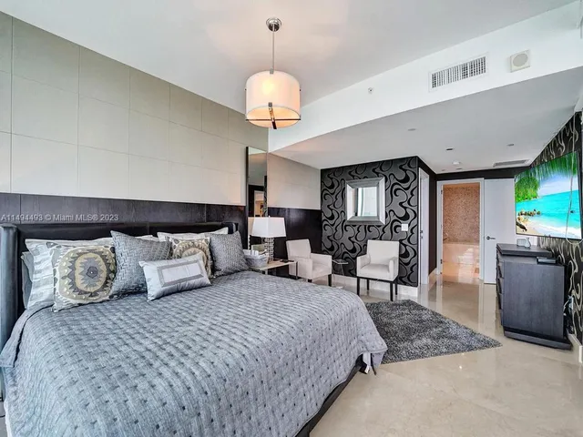 a balcony view with a seating space