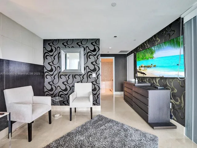 a bedroom with two beds and a window