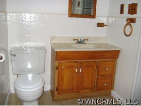 149 Howards Hollow Road Canton, NC 28716 - Photo 11 of 12 a bathroom with a toilet and a sink