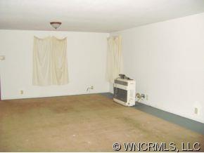 149 Howards Hollow Road Canton, NC 28716 - Photo 4 of 12 a view of a storage & utility room with wooden floor