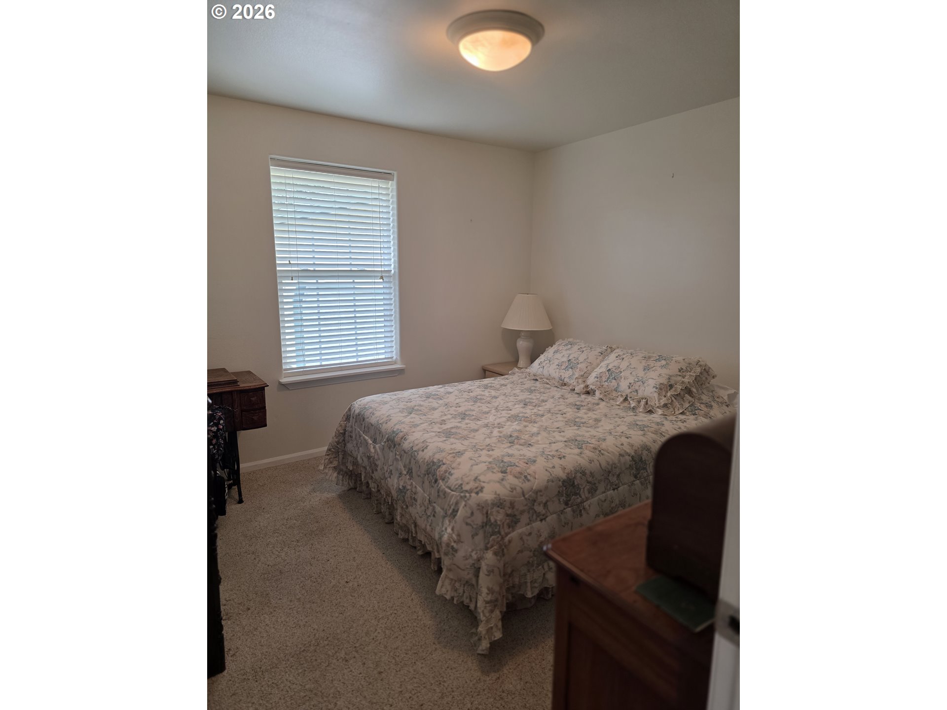 1909 Southwest Duke Road Sutherlin, OR 97479 - Photo 21 of 30 a bedroom with a bed and a window