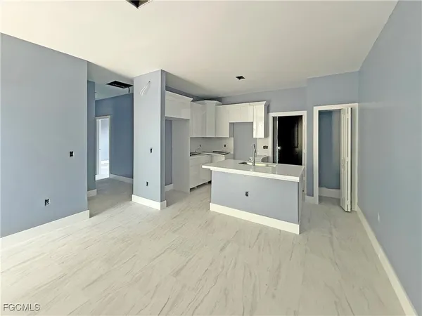 a view of a kitchen with a sink