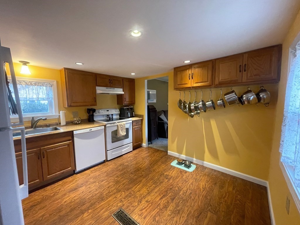 4 Oakhurst Road Ayer, MA 01432 - Photo 11 of 13 a kitchen with a refrigerator and a sink