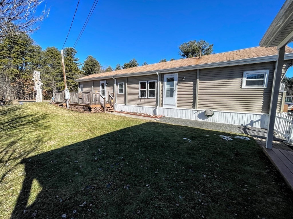 4 Oakhurst Road Ayer, MA 01432 - Photo 3 of 13 a front view of a house with a garden