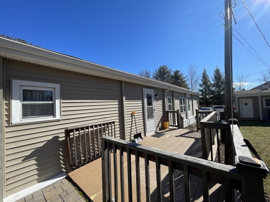 4 Oakhurst Road Ayer, MA 01432 - Photo 4 of 13 a view of deck with a wooden fence