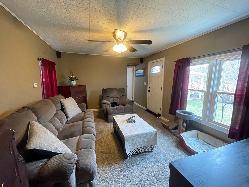 4 Oakhurst Road Ayer, MA 01432 - Photo 9 of 13 a living room with furniture and a large window