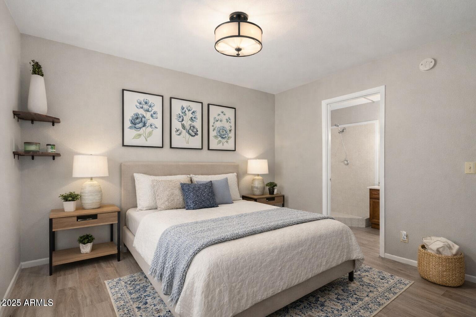 15601 North 27th Street, Unit 33 Phoenix, AZ 85032 - Photo 13 of 23 a bedroom with a bed and wooden floor