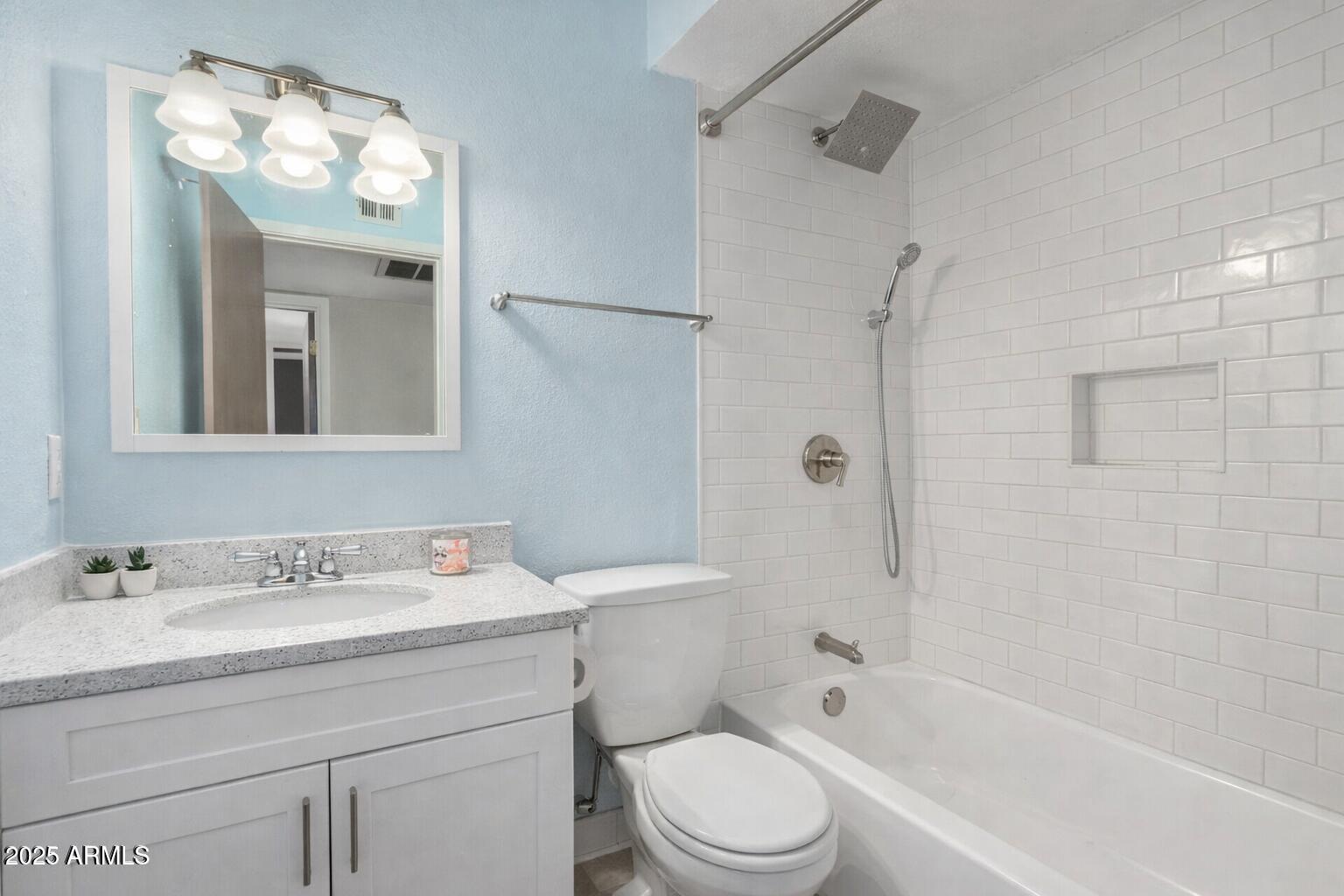 15601 North 27th Street, Unit 33 Phoenix, AZ 85032 - Photo 19 of 23 a bathroom with a sink a toilet and shower
