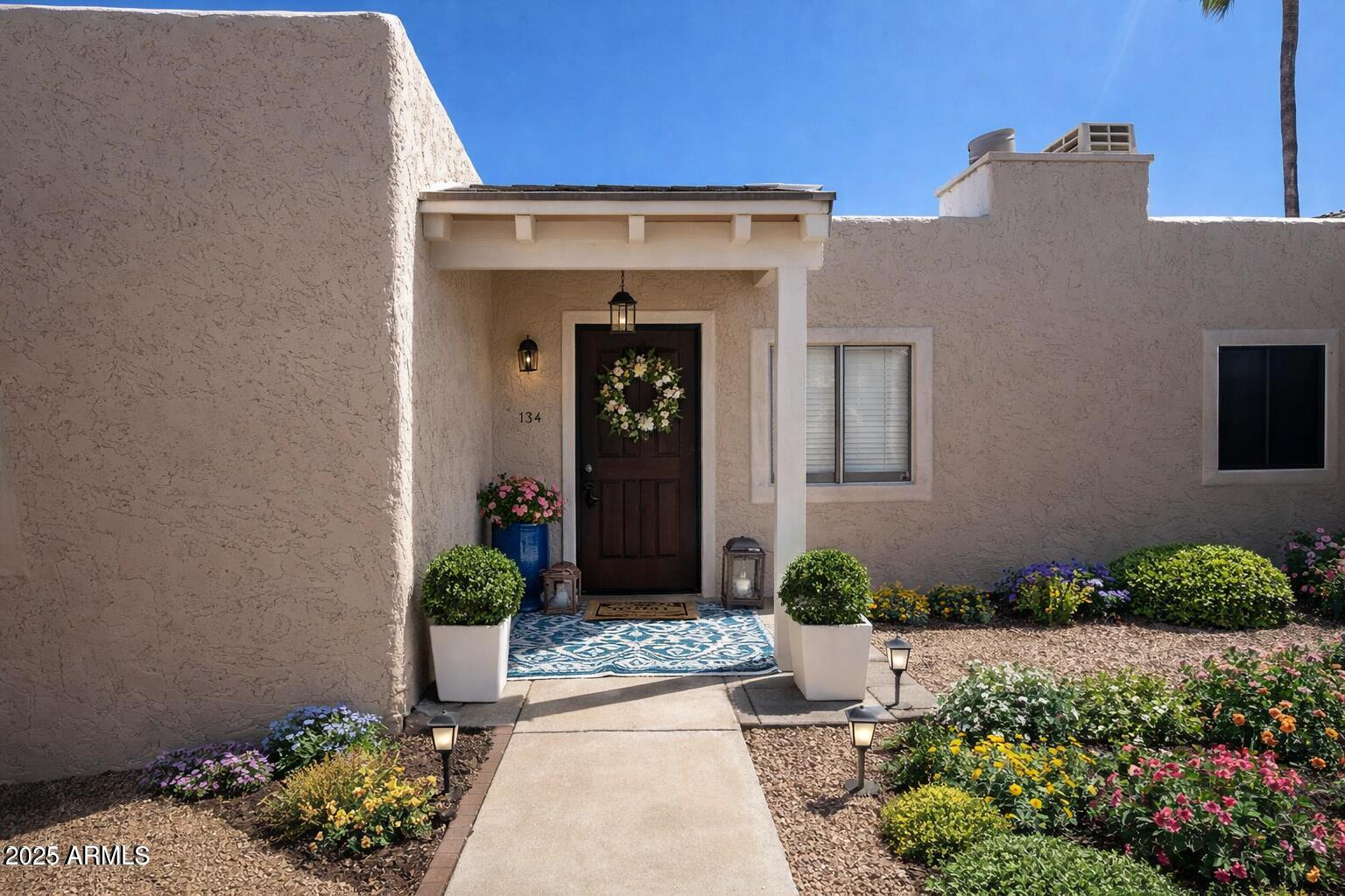 15601 North 27th Street, Unit 33 Phoenix, AZ 85032 - Photo 2 of 23 a front view of a house