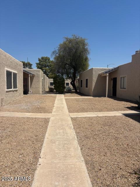 15601 North 27th Street, Unit 33 Phoenix, AZ 85032 - Photo 4 of 23 a view of a house with a yard