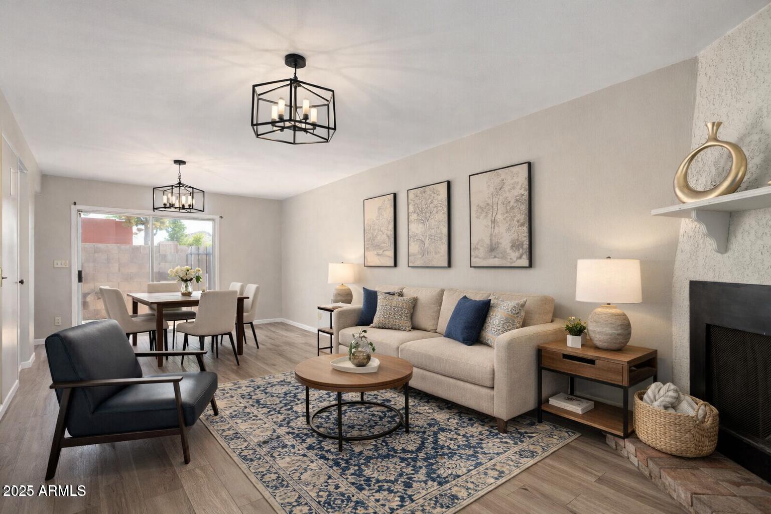 15601 North 27th Street, Unit 33 Phoenix, AZ 85032 - Photo 6 of 23 a living room with furniture a rug and a chandelier
