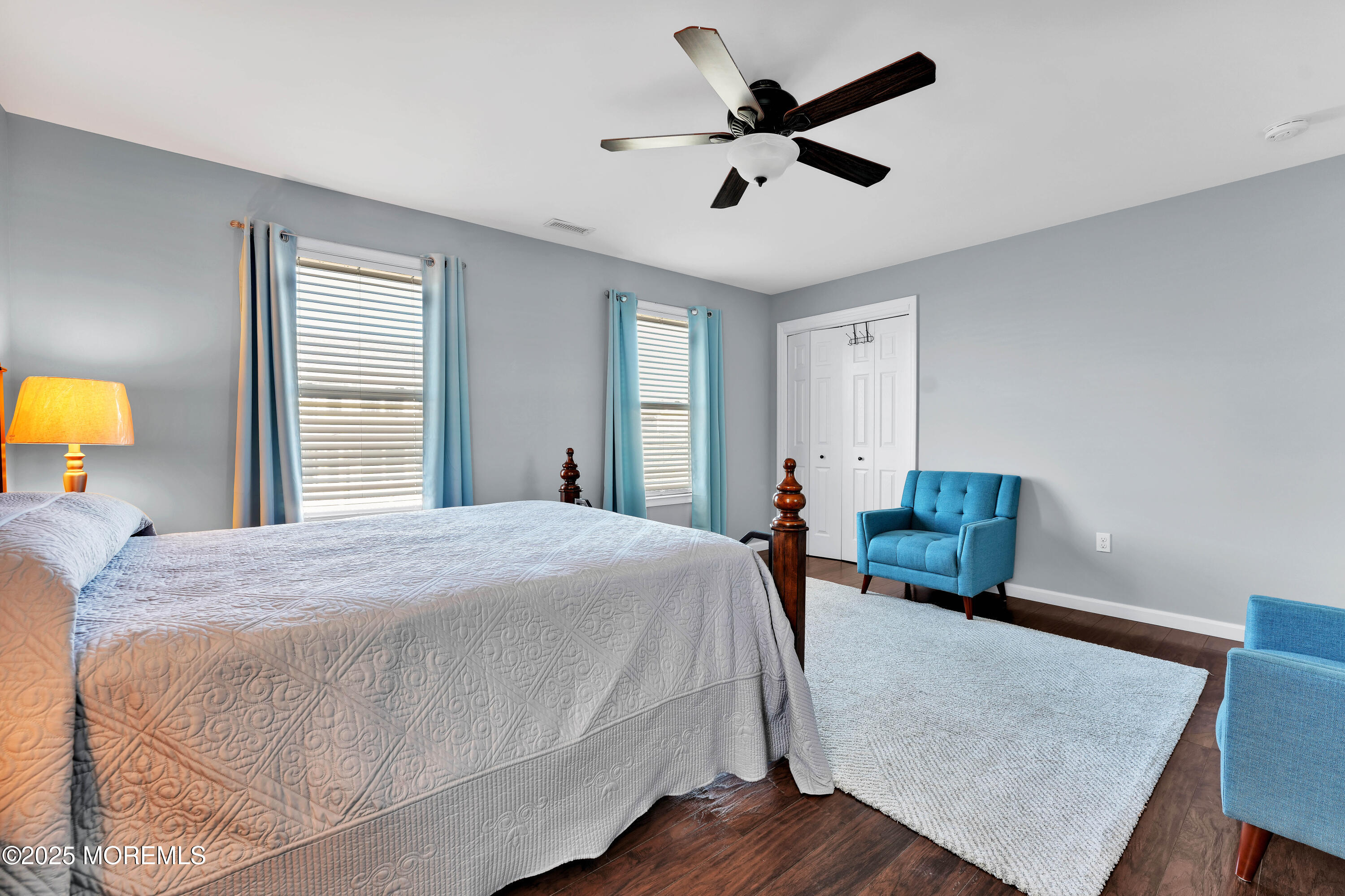 115 Harding Avenue, Unit B Seaside Heights, NJ 08751 - Photo 11 of 16 a bed room with a bed a chandelier and a window