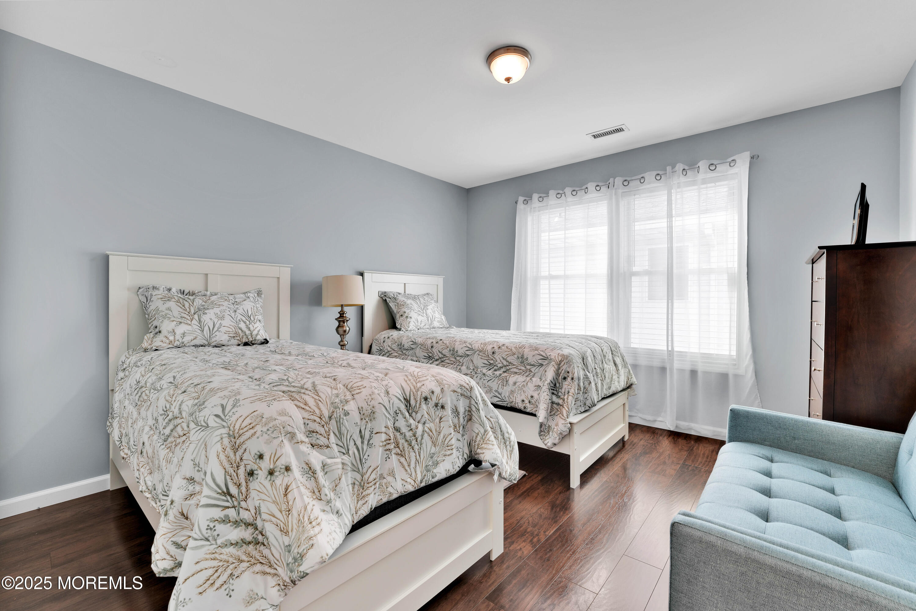 115 Harding Avenue, Unit B Seaside Heights, NJ 08751 - Photo 13 of 16 a bedroom with a bed couch and window