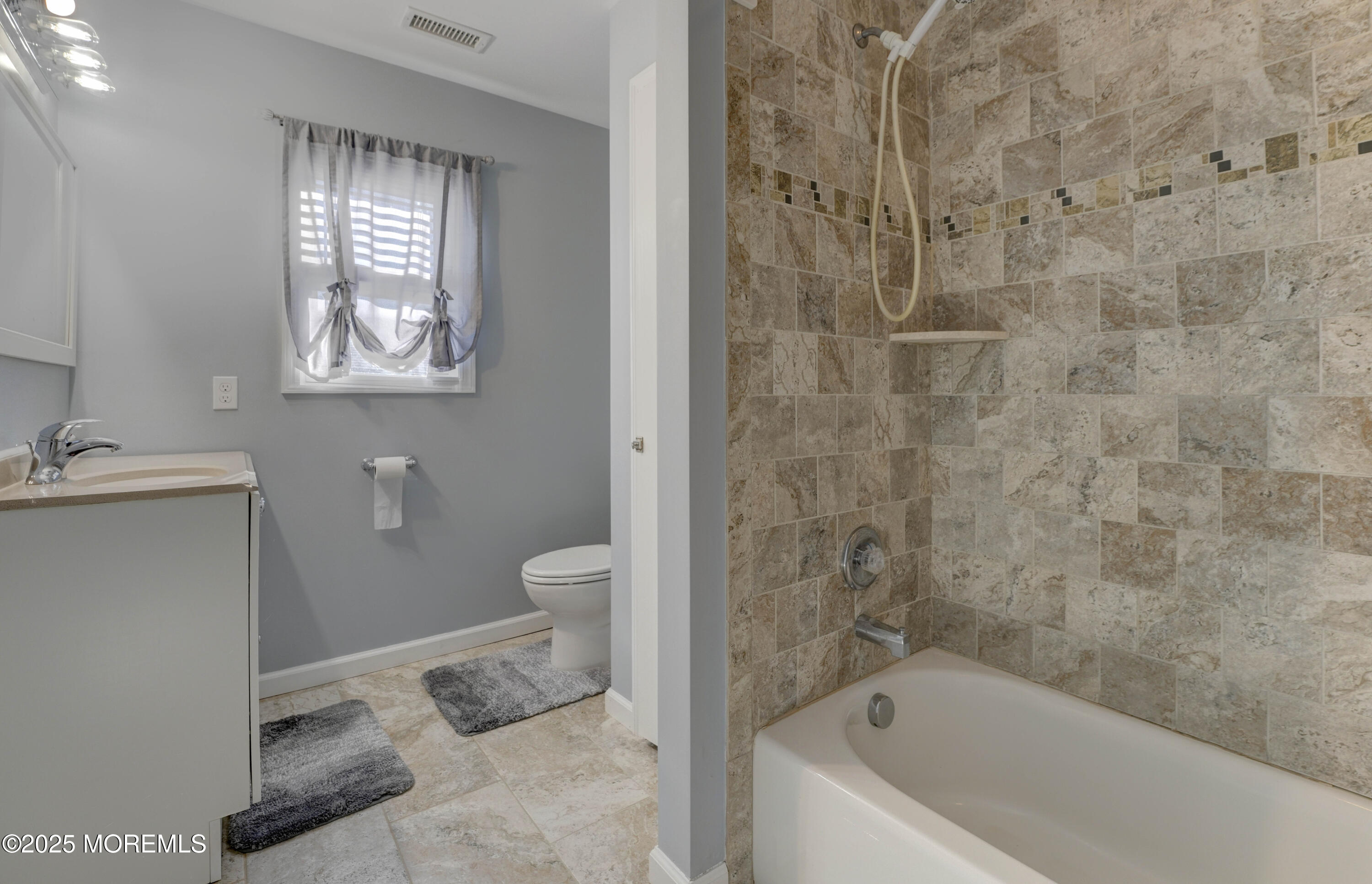 115 Harding Avenue, Unit B Seaside Heights, NJ 08751 - Photo 14 of 16 a bathroom with a bathtub sink and toilet