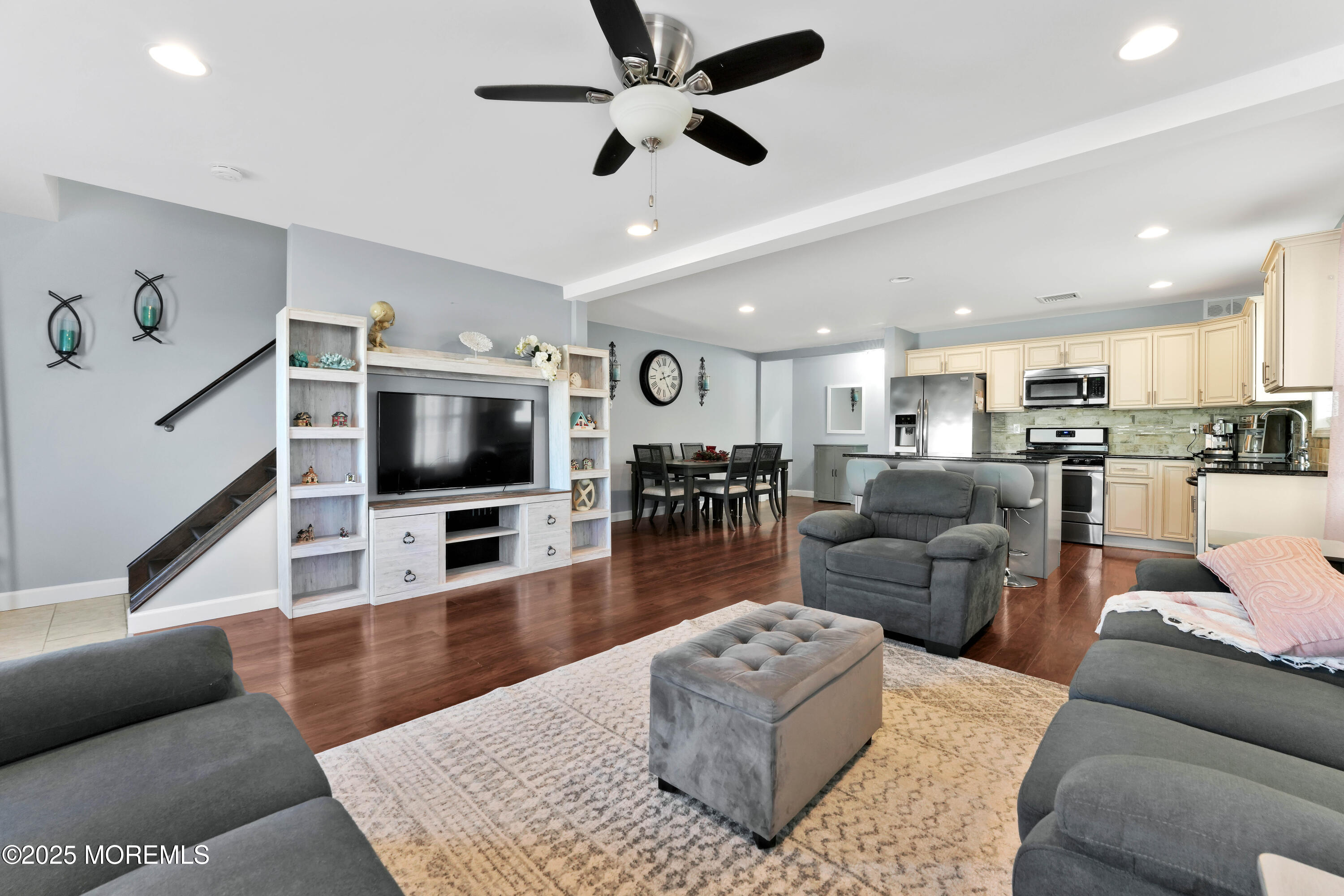 115 Harding Avenue, Unit B Seaside Heights, NJ 08751 - Photo 4 of 16 a living room with furniture kitchen view and a flat screen tv