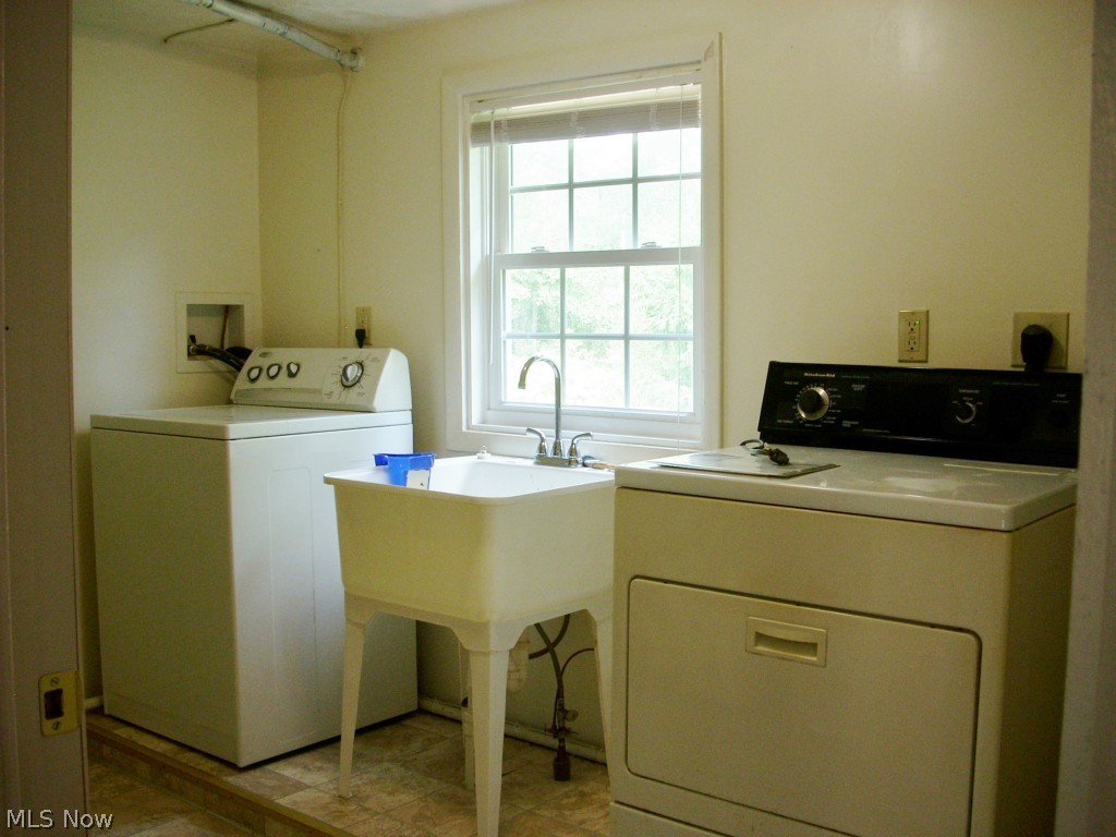 6931 North Ridge Road East Geneva, OH 44041 - Photo 9 of 25 The laundry/furnace room is conveniently located by the bathroom and bedrooms. The AC is zoned for each side of the house.