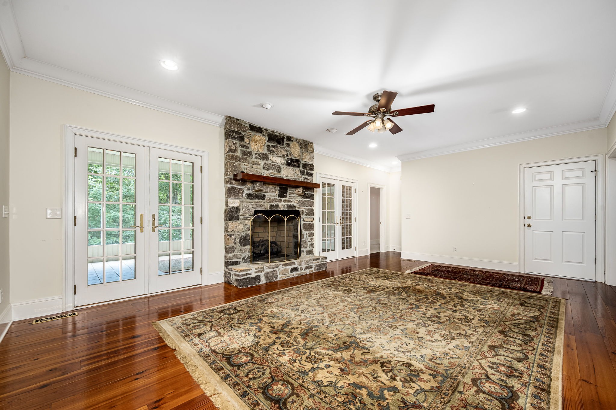 255 Parks Drive Normandy, TN 37360 - Photo 29 of 82 wooden floor in an empty room with a fireplace
