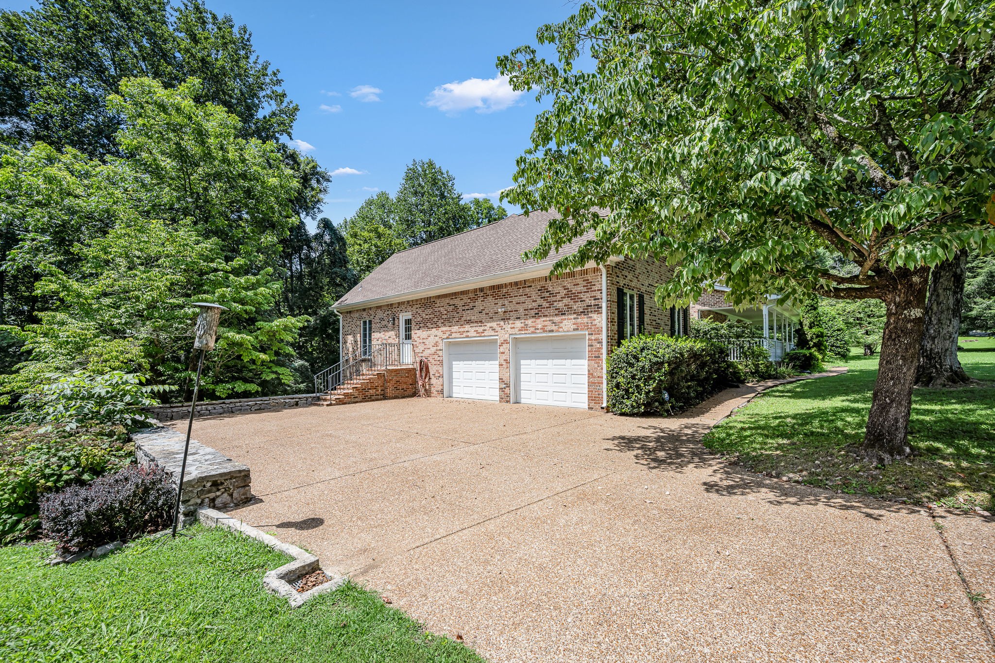 255 Parks Drive Normandy, TN 37360 - Photo 55 of 82 a front view of a house with a yard and a garage