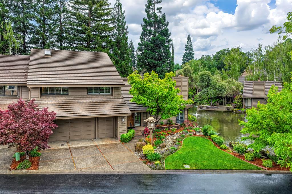 7650 Pineridge Road Fair Oaks, CA 95628 - Photo 54 of 67 View of the home, front yard, and the lake