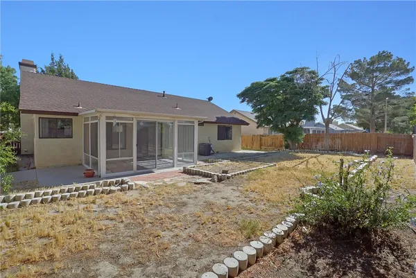 a house with trees in the background