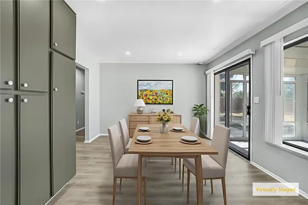 a view of a dining room with furniture and window