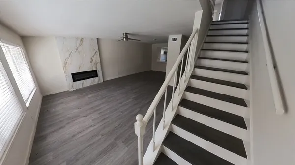 a view of a hallway with windows