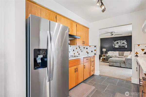 a kitchen with stainless steel appliances a refrigerator and a stove